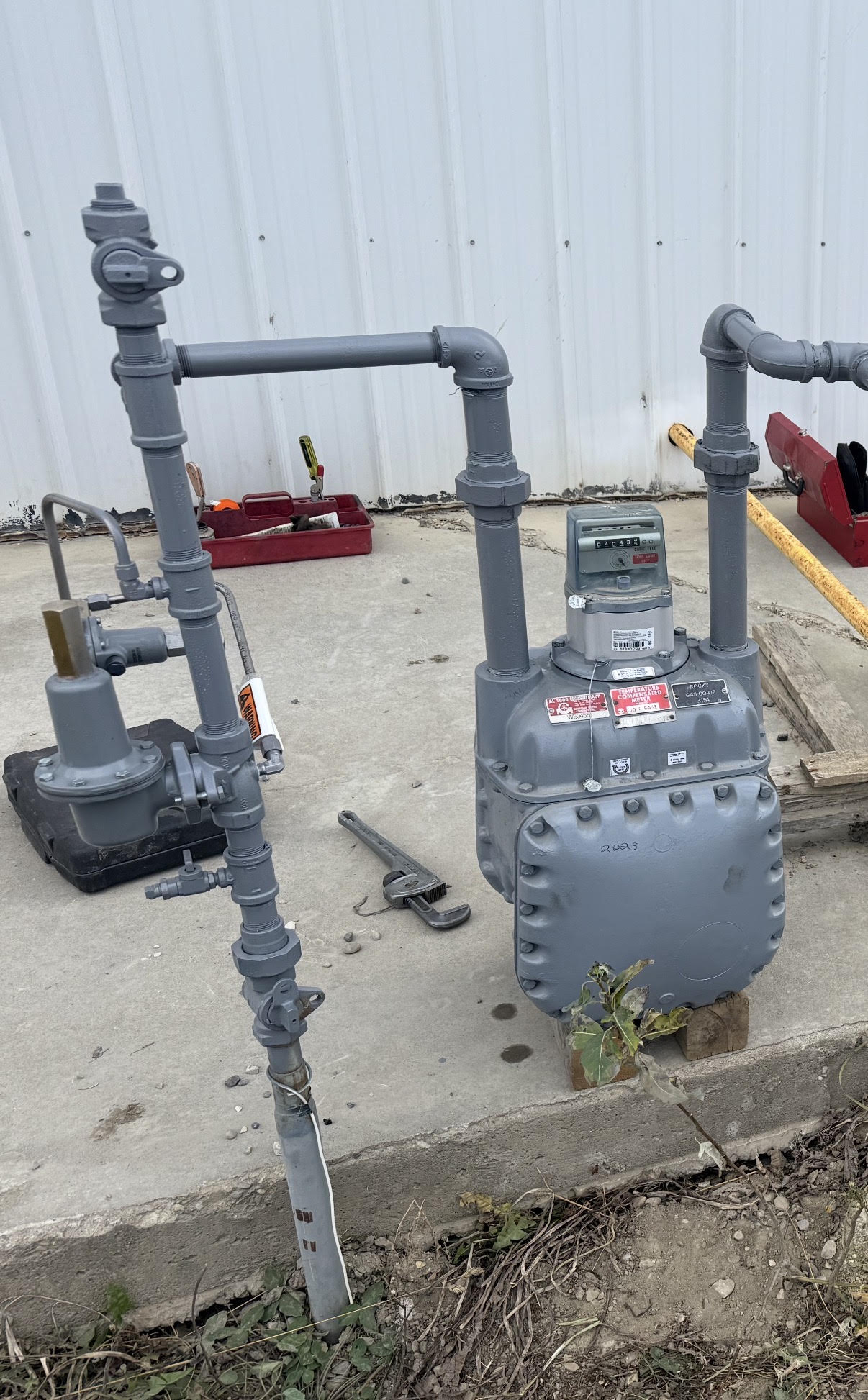An installed gas meter on a residence.